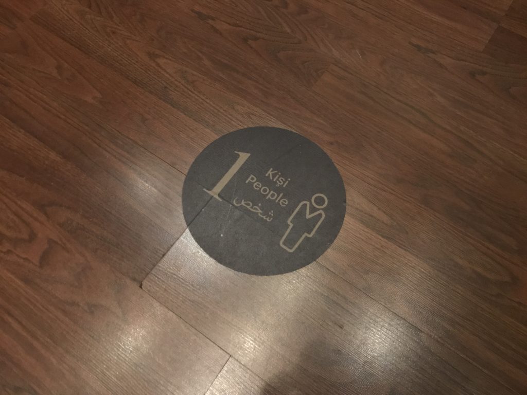 a circular sign on a wood floor