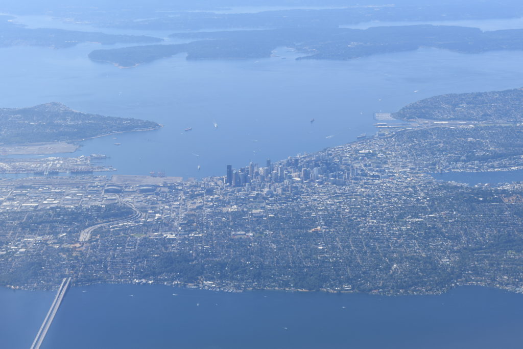 an aerial view of a city and water
