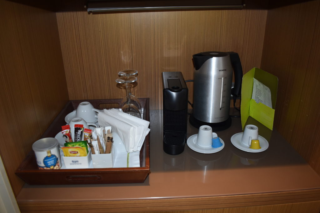a tray of coffee and tea items on a counter