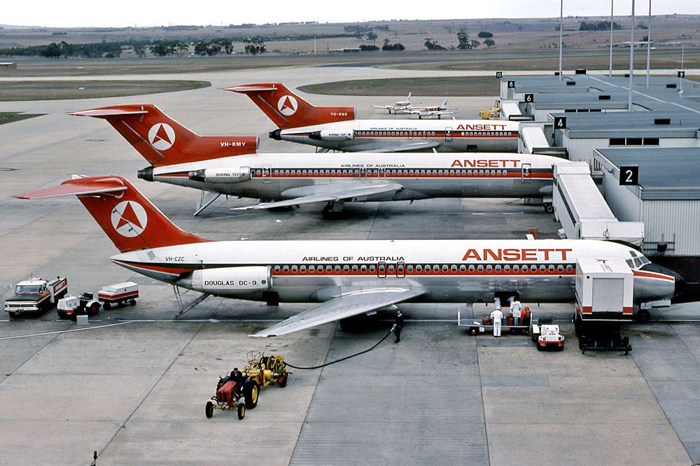 several airplanes at an airport