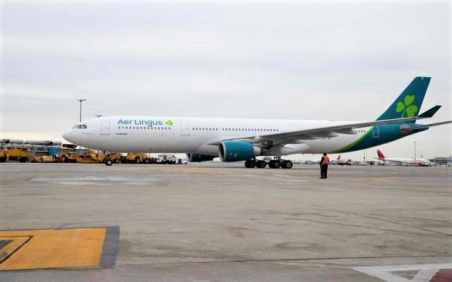 a large white airplane on a runway