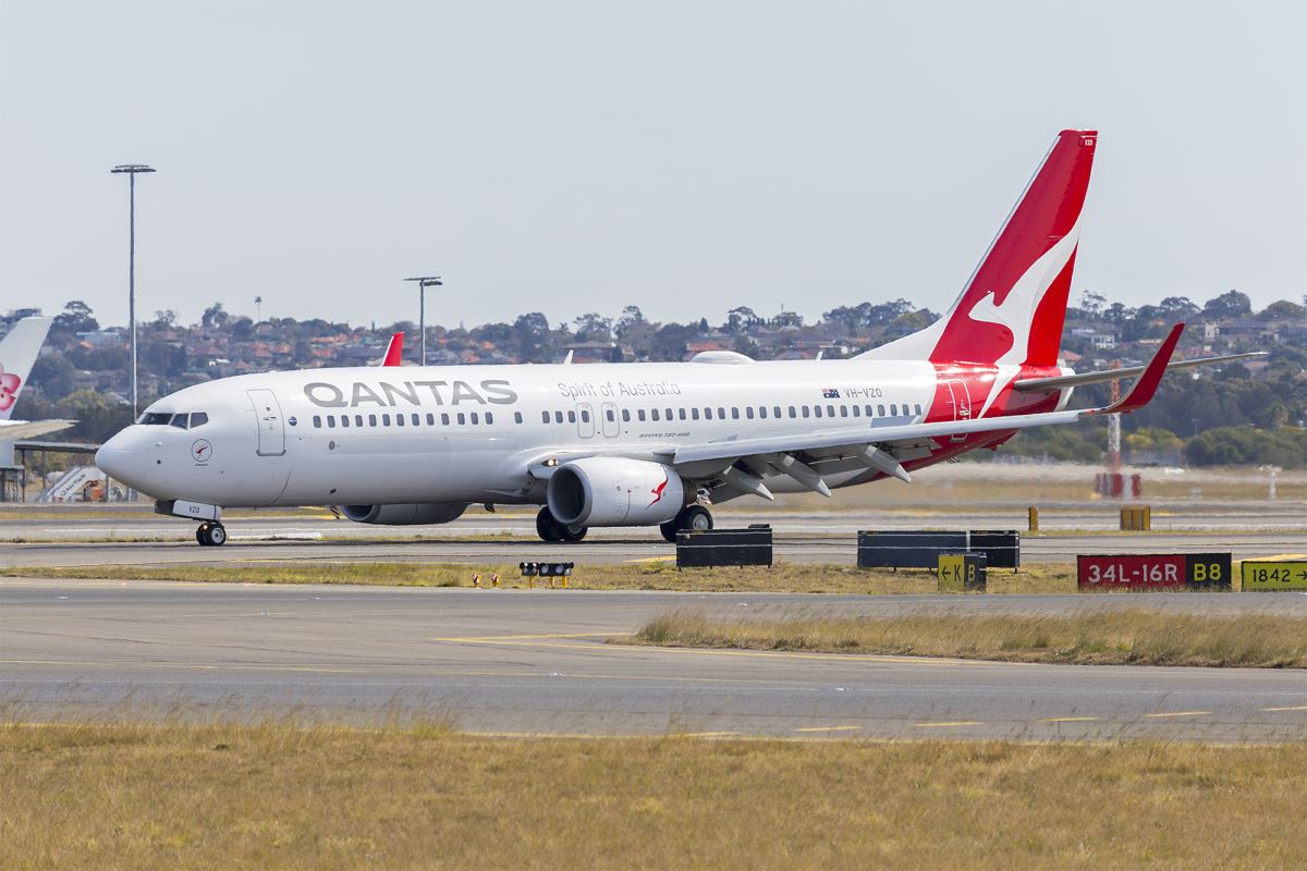 a white airplane on a runway