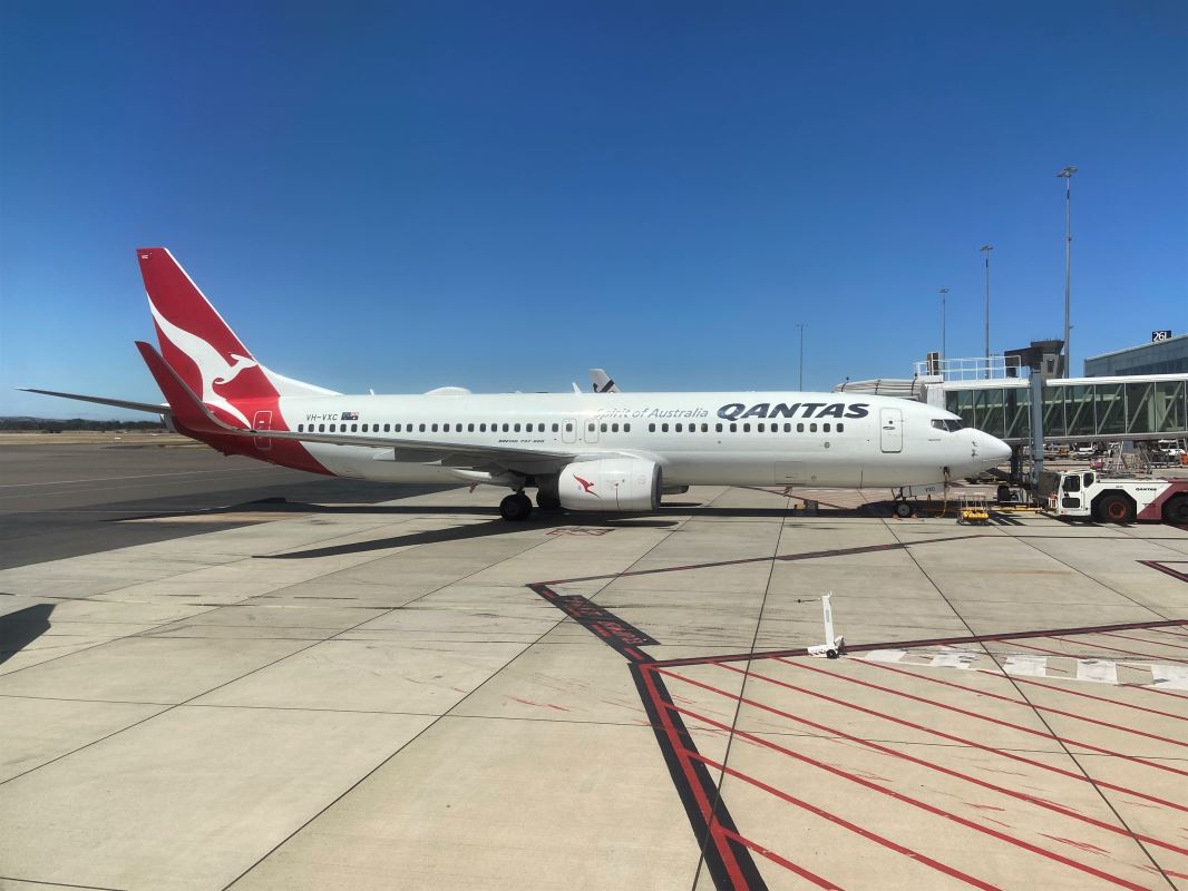 a white airplane on a runway