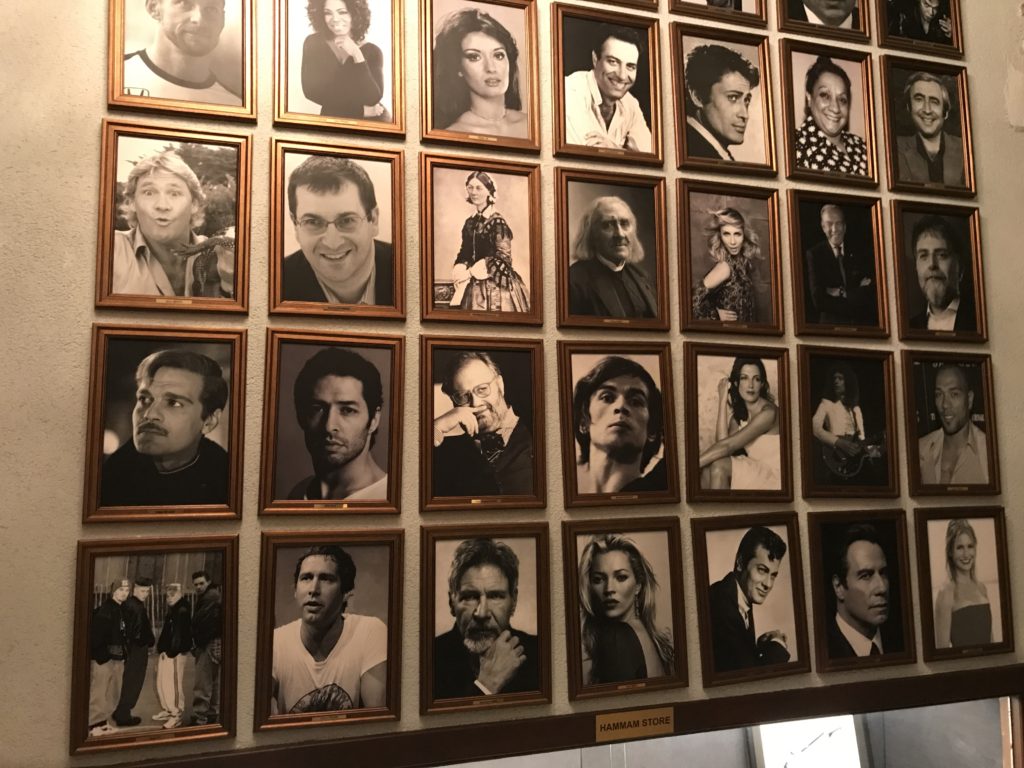 a wall of pictures of people