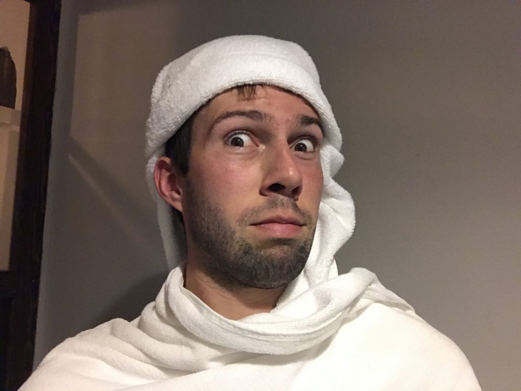 a man wearing a towel on his head