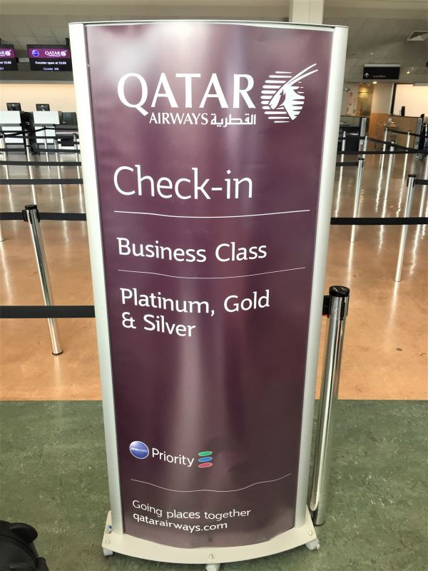Qatar Airways business class check-in sign