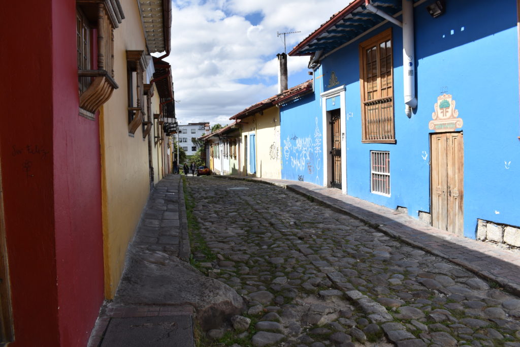 a cobblestone street with colorful buildings