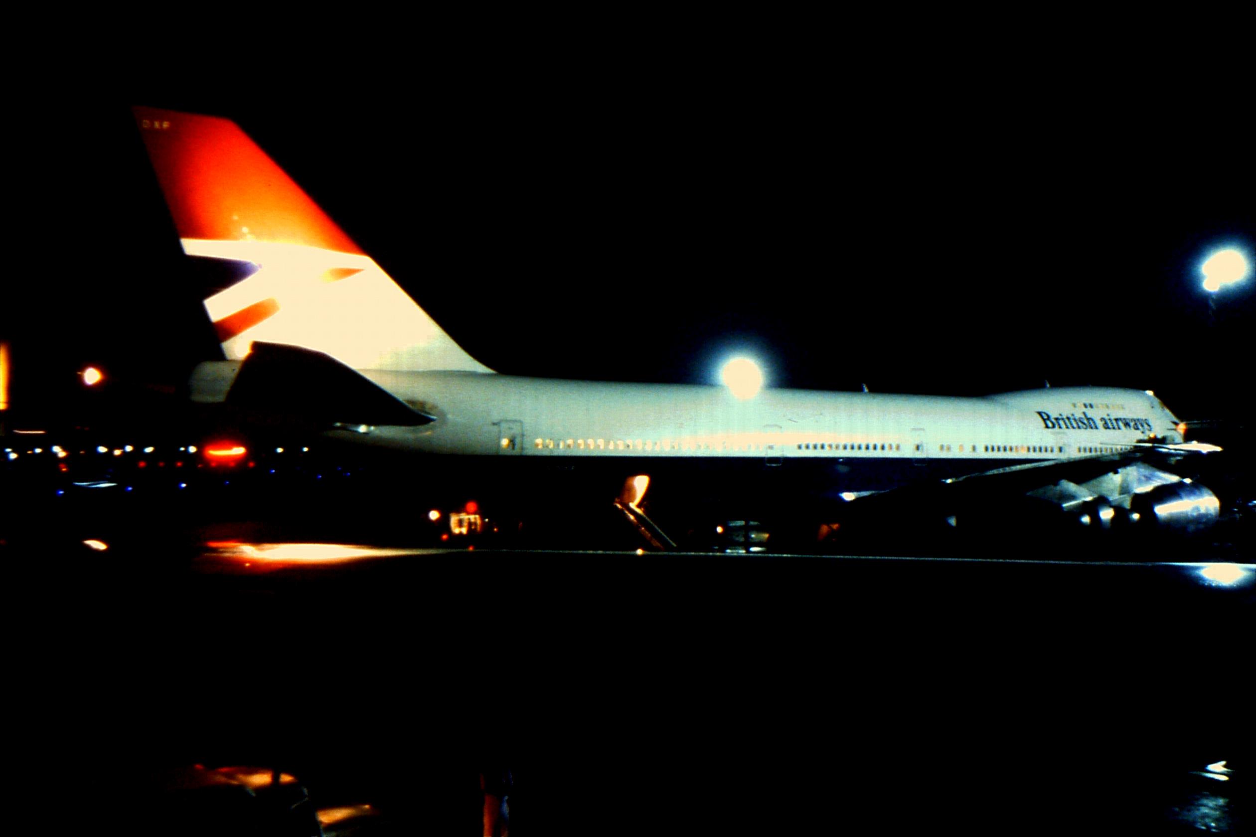 a plane at night with lights on