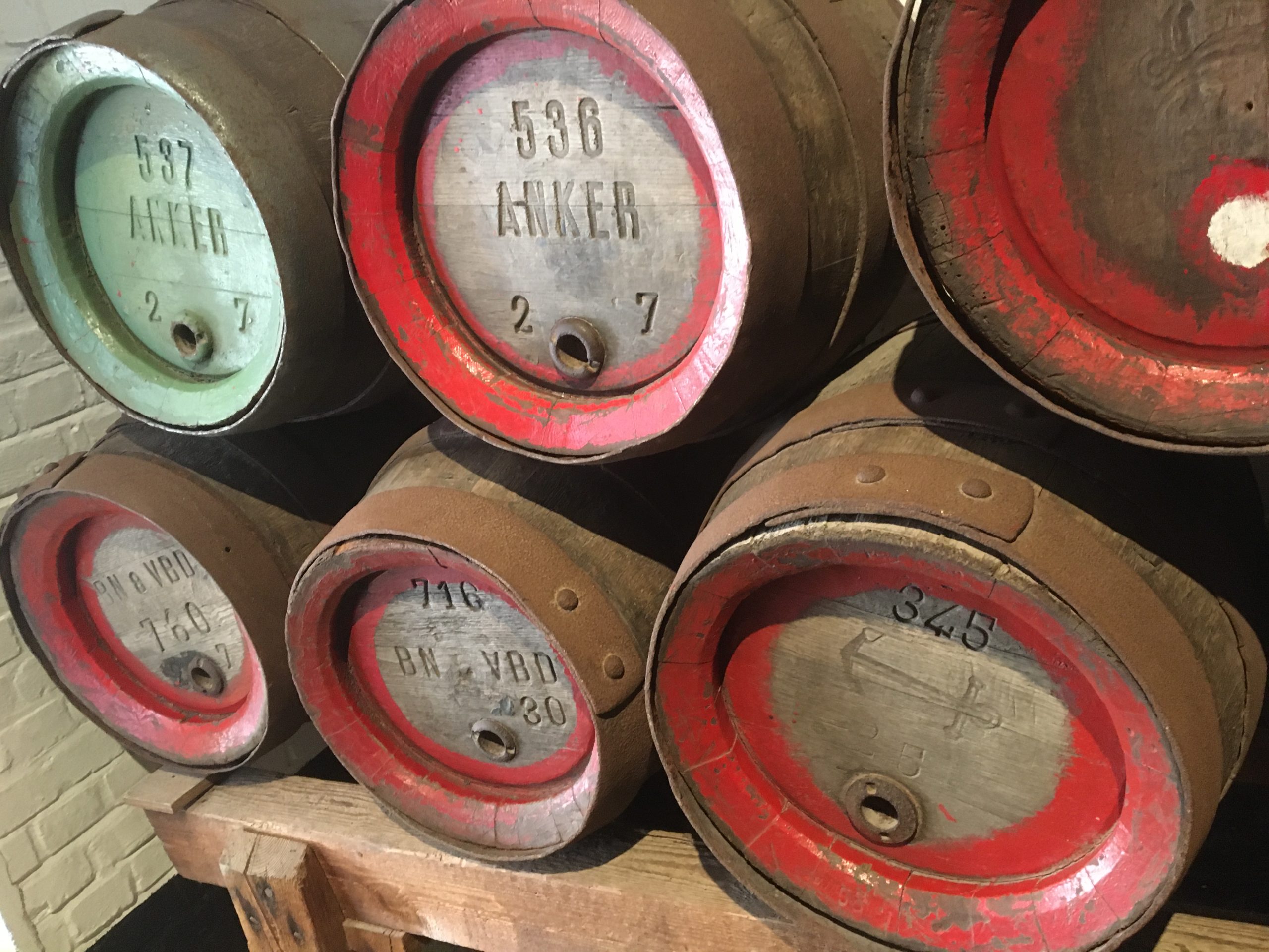 a group of barrels stacked on a wooden pallet