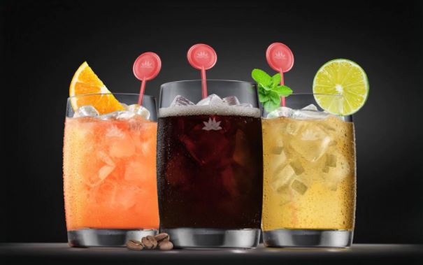 Which airlines offer signature cocktails on board?