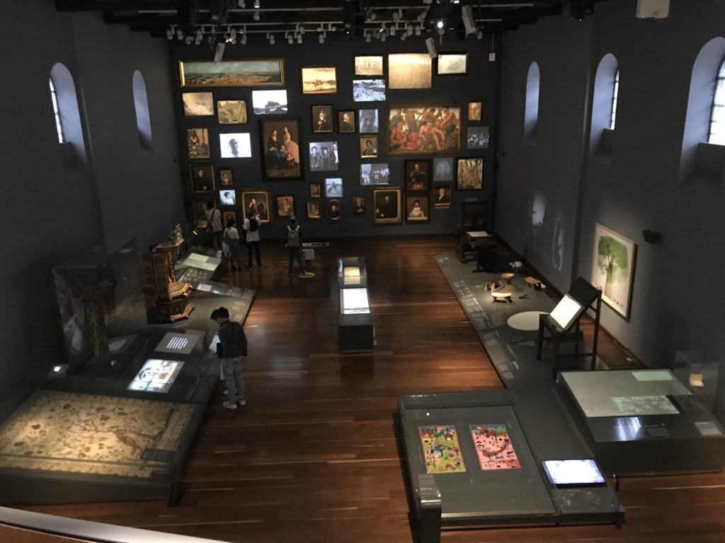 a room with many pictures on display