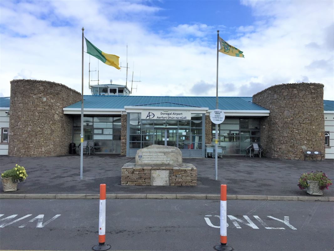 a building with flags in front of it