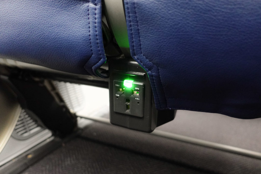 a power outlet with a green light
