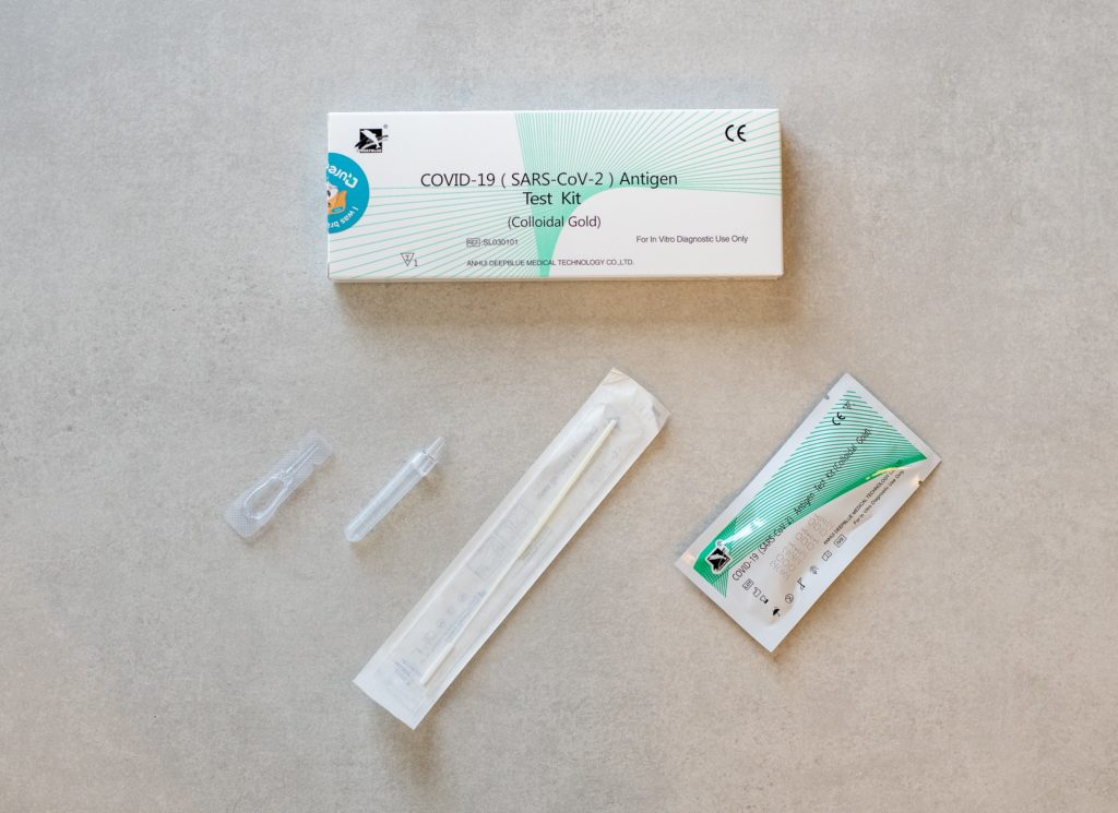 a box of test kit and needles