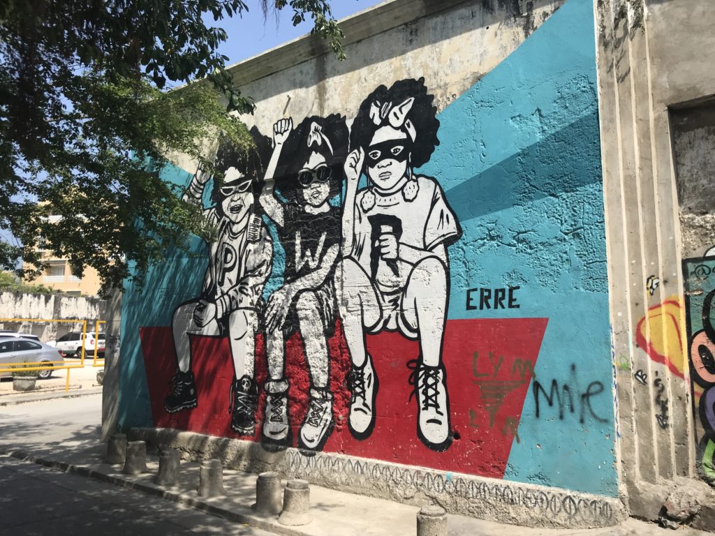 a mural of kids on a wall