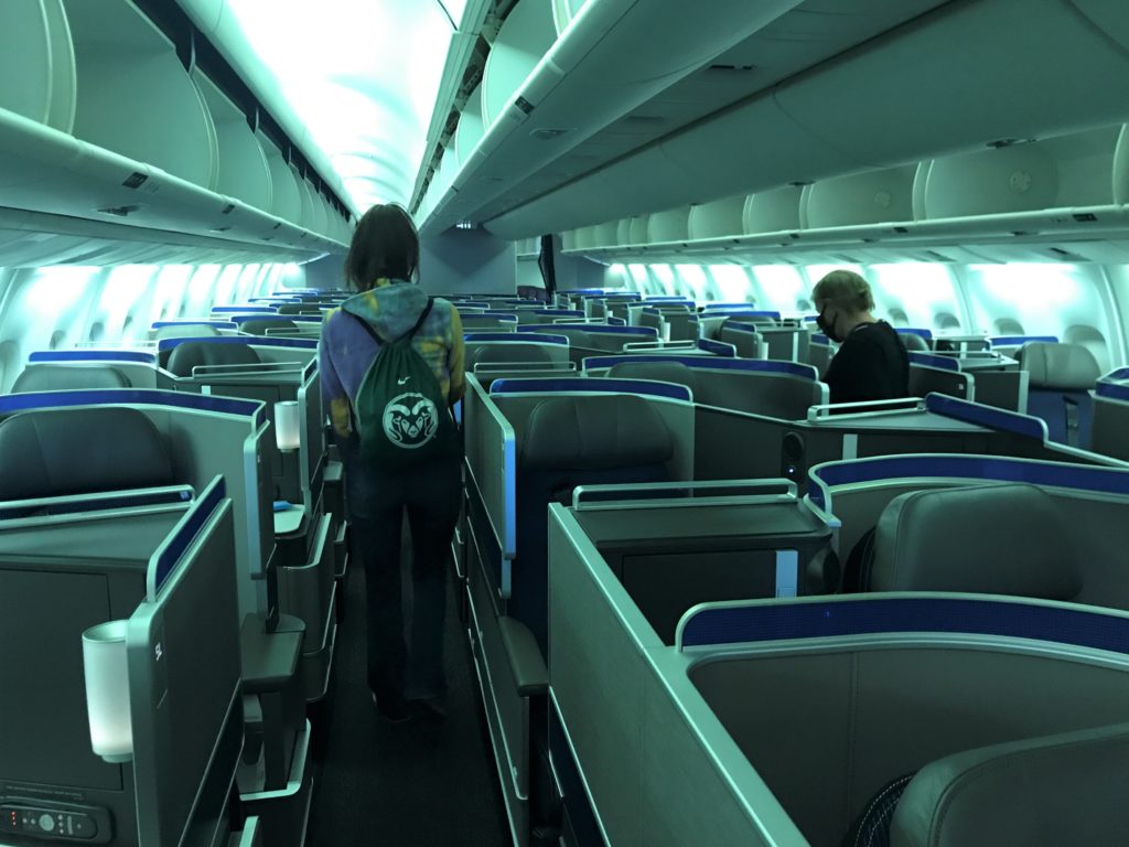 a person walking in an airplane
