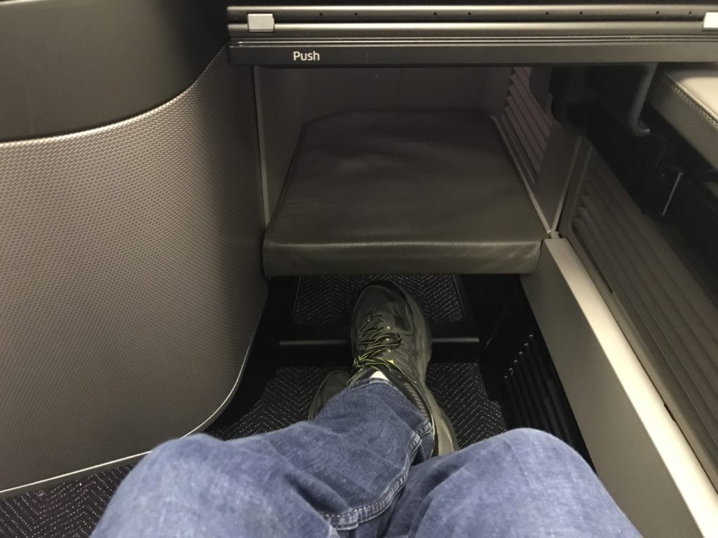 a person's feet in a seat