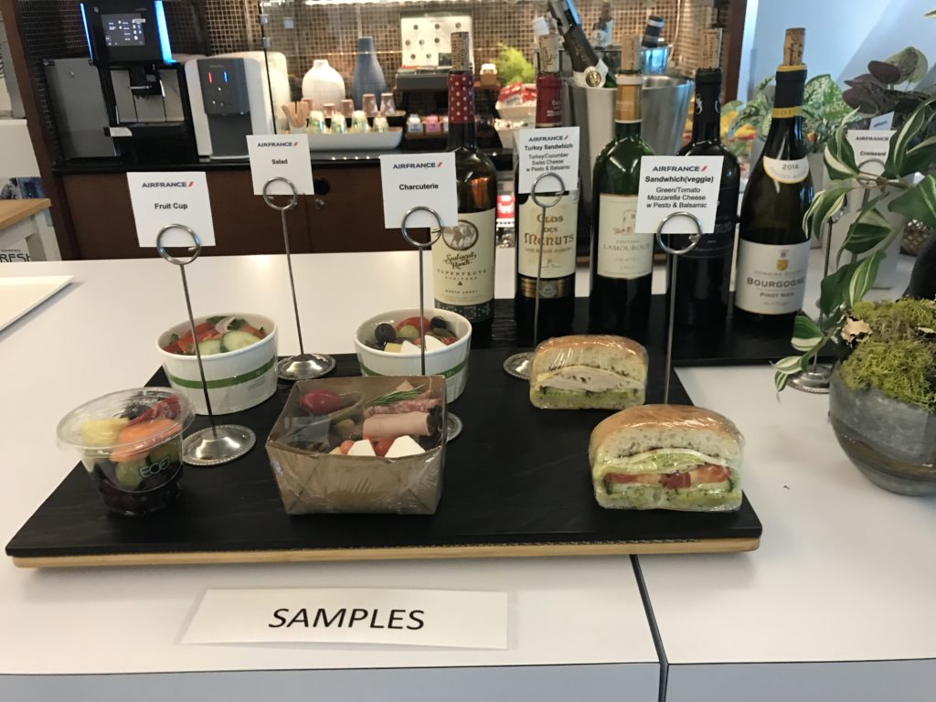 a table with food and bottles of wine