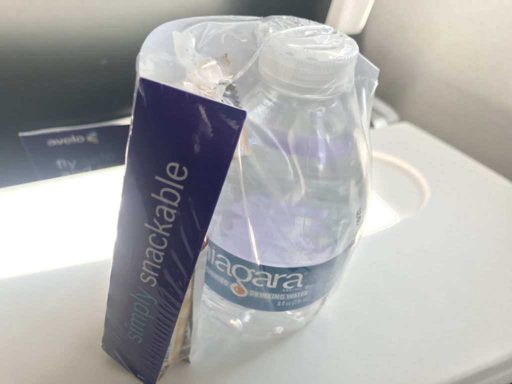 a plastic bottle and a package of water
