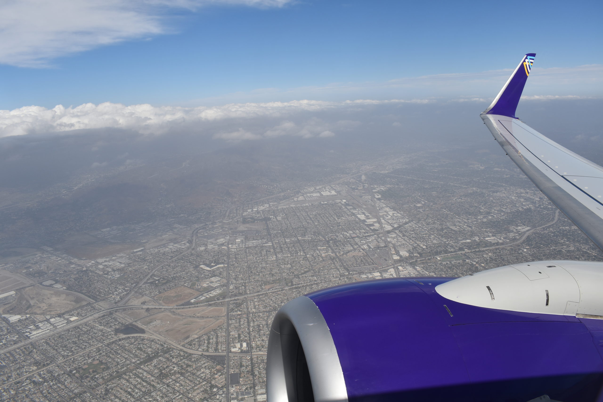 an airplane wing and engine of an airplane