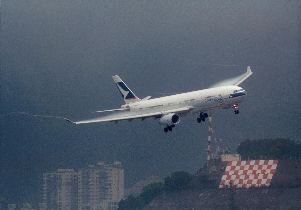 a plane flying over a building