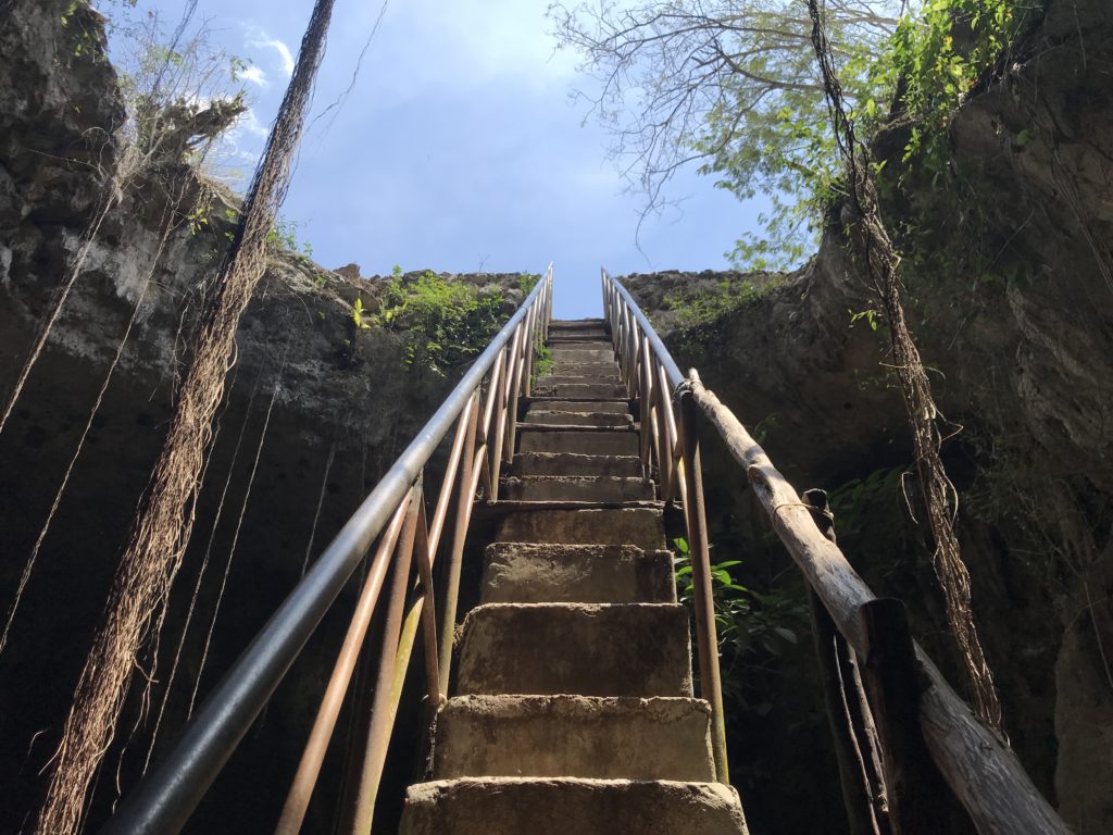 a stairs leading up to a cliff