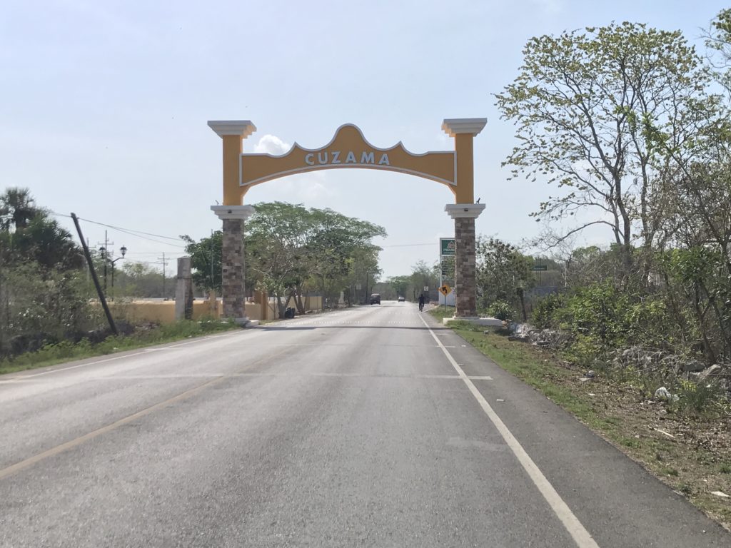 a road with a sign over it