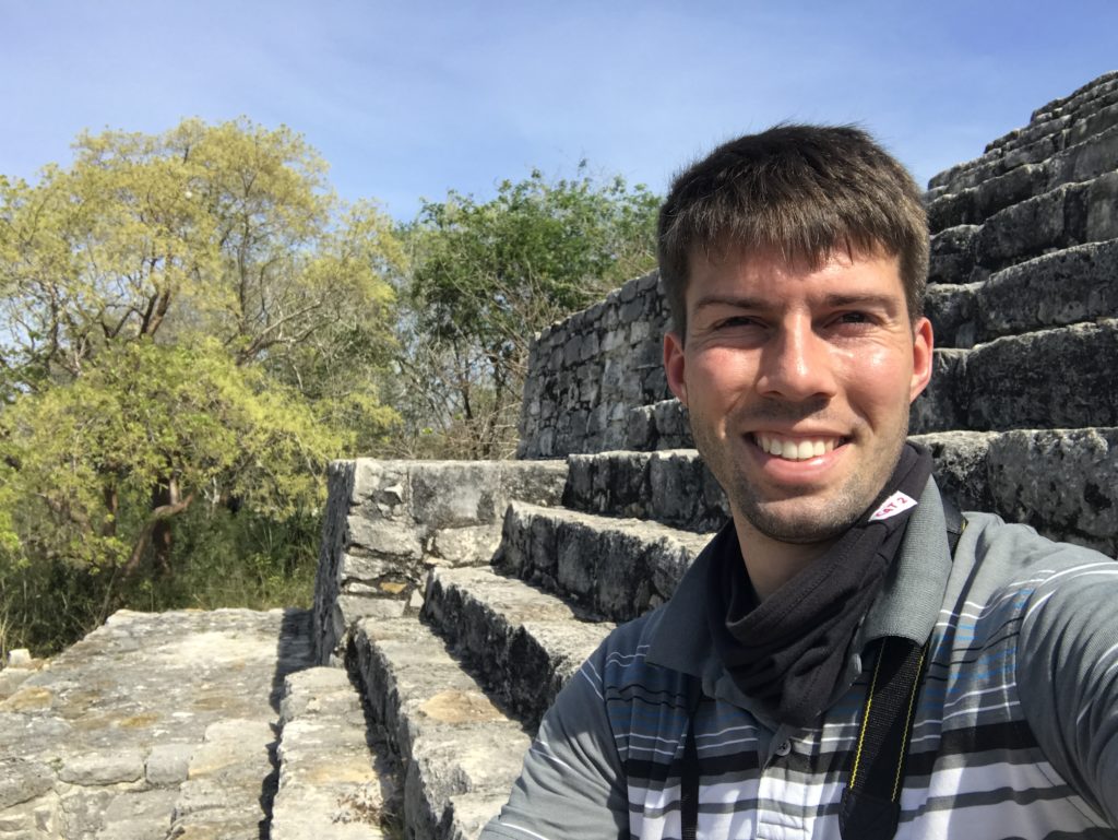 a man smiling at camera