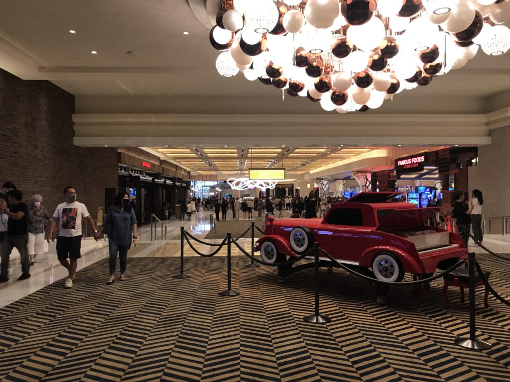 a red car in a large room