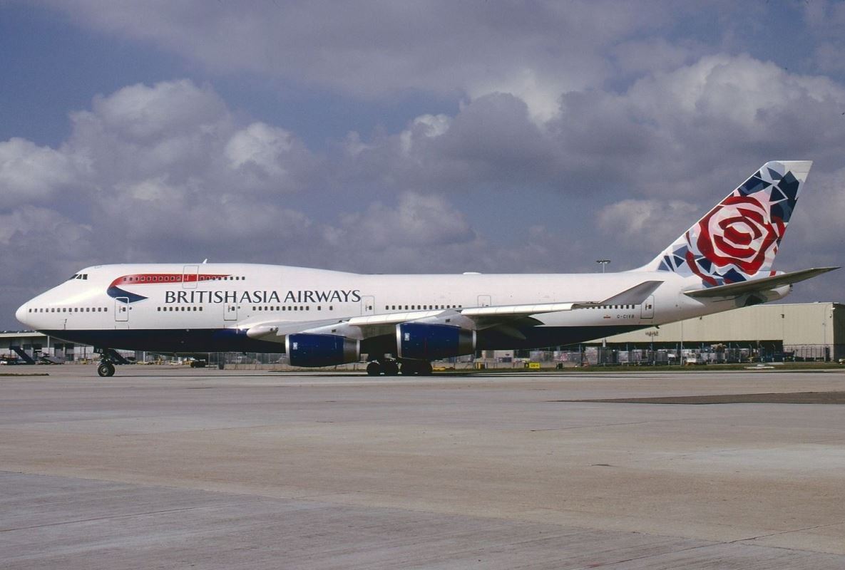 a large white airplane on a runway