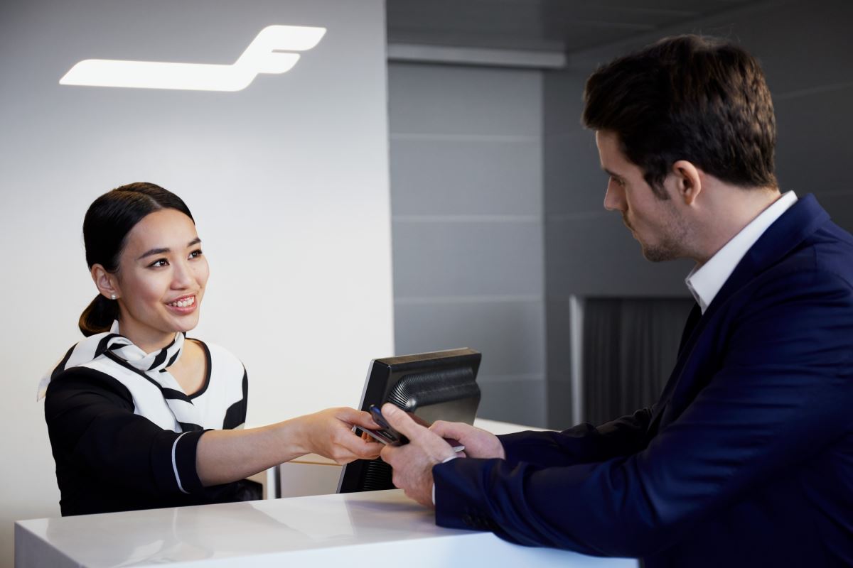 a man and woman at a reception desk