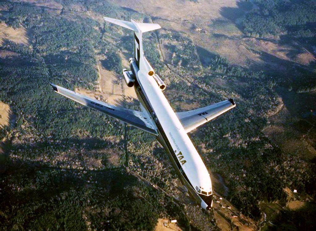 an airplane flying over a landscape