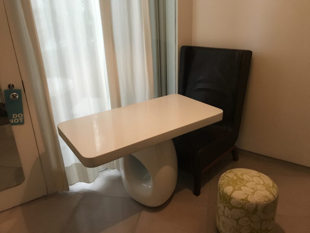 a table and chair in a room