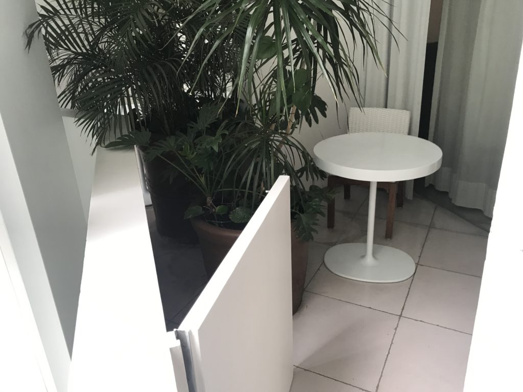a white table and potted plants