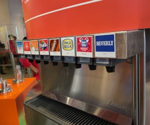 a soda dispenser with labels