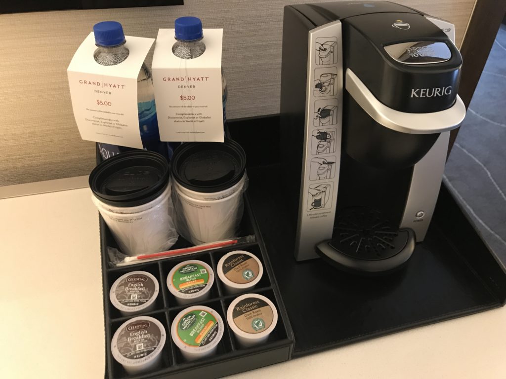 a coffee machine and a tray of k-cups