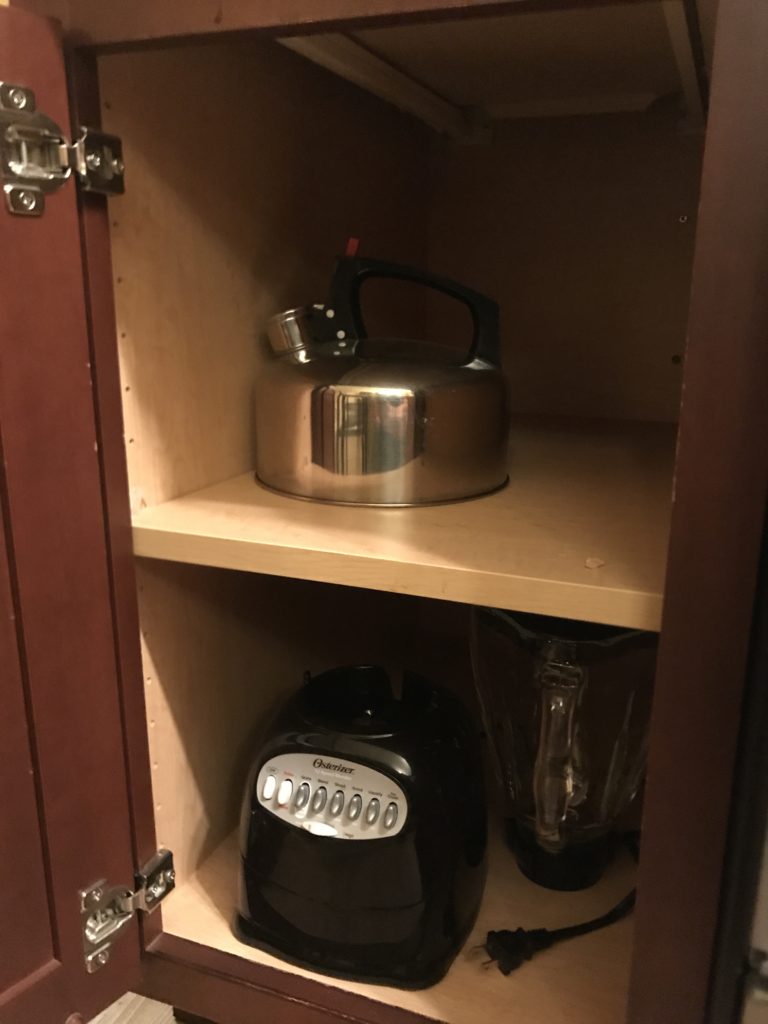 a kitchen appliances on a shelf