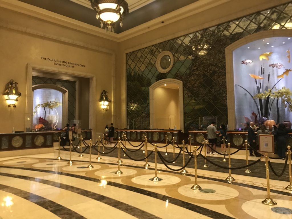 a large lobby with a marble floor and a marble floor