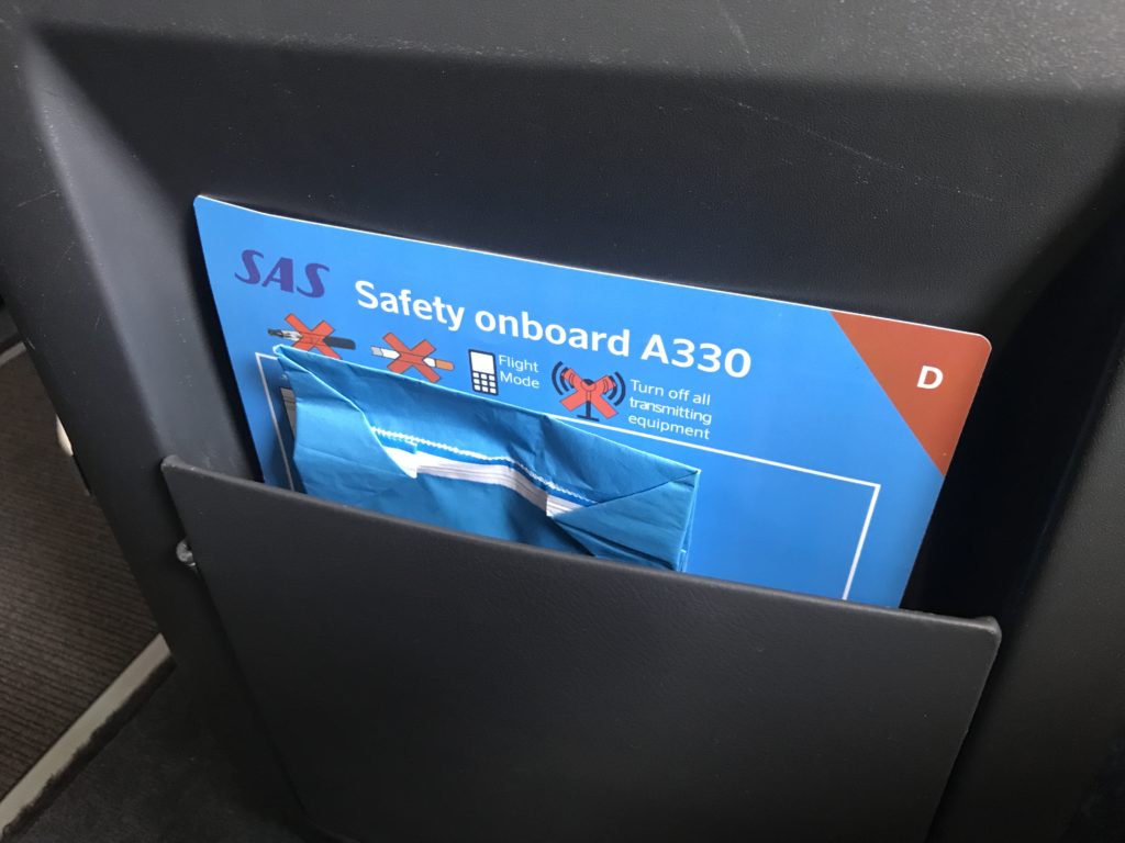 a blue and red safety board in a pocket