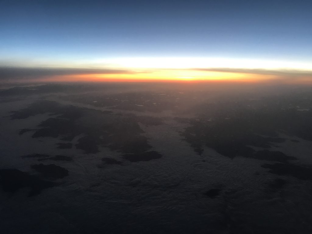 a view of the sun setting over the horizon