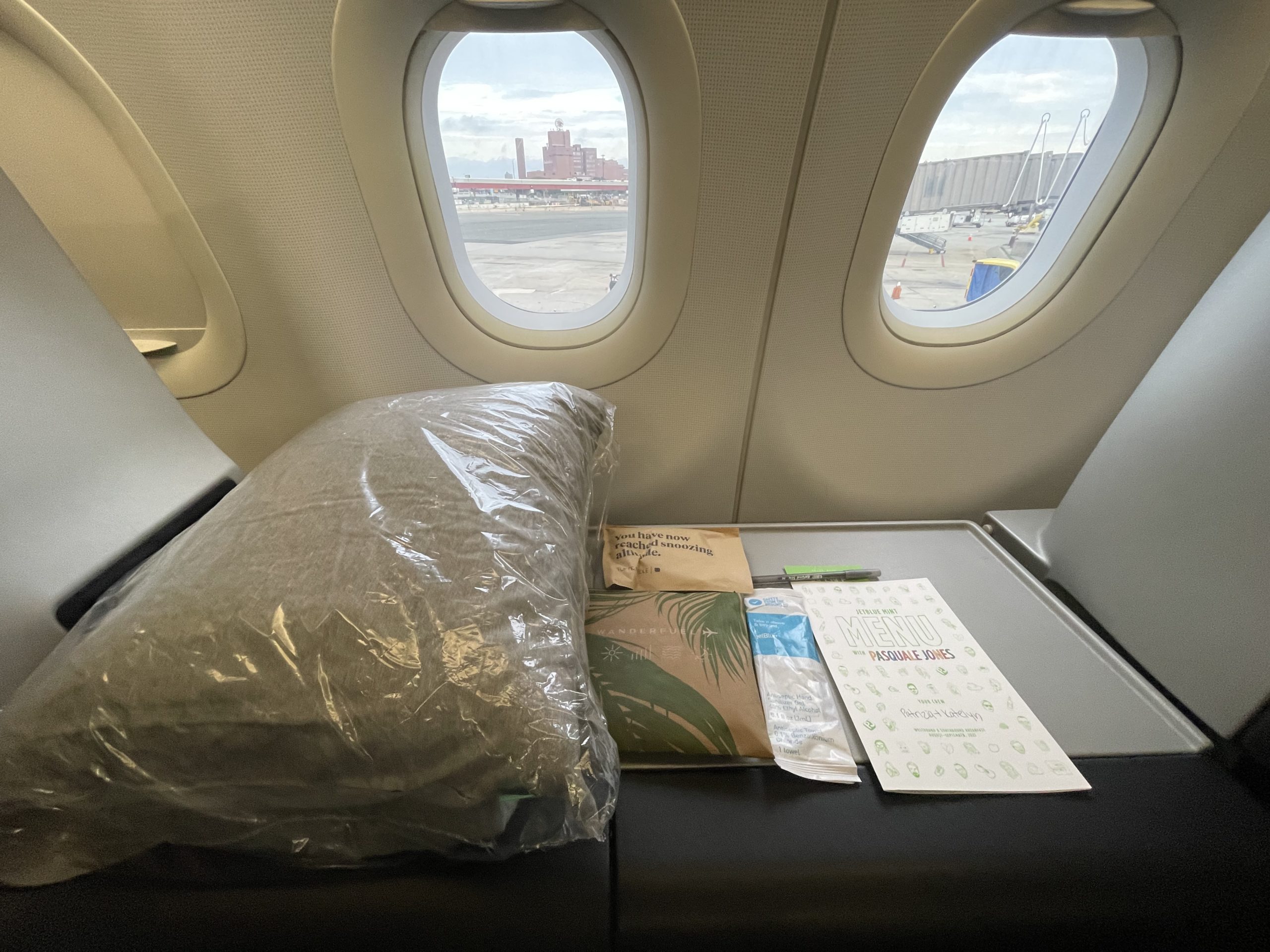 a seat with a pillow and a book on it