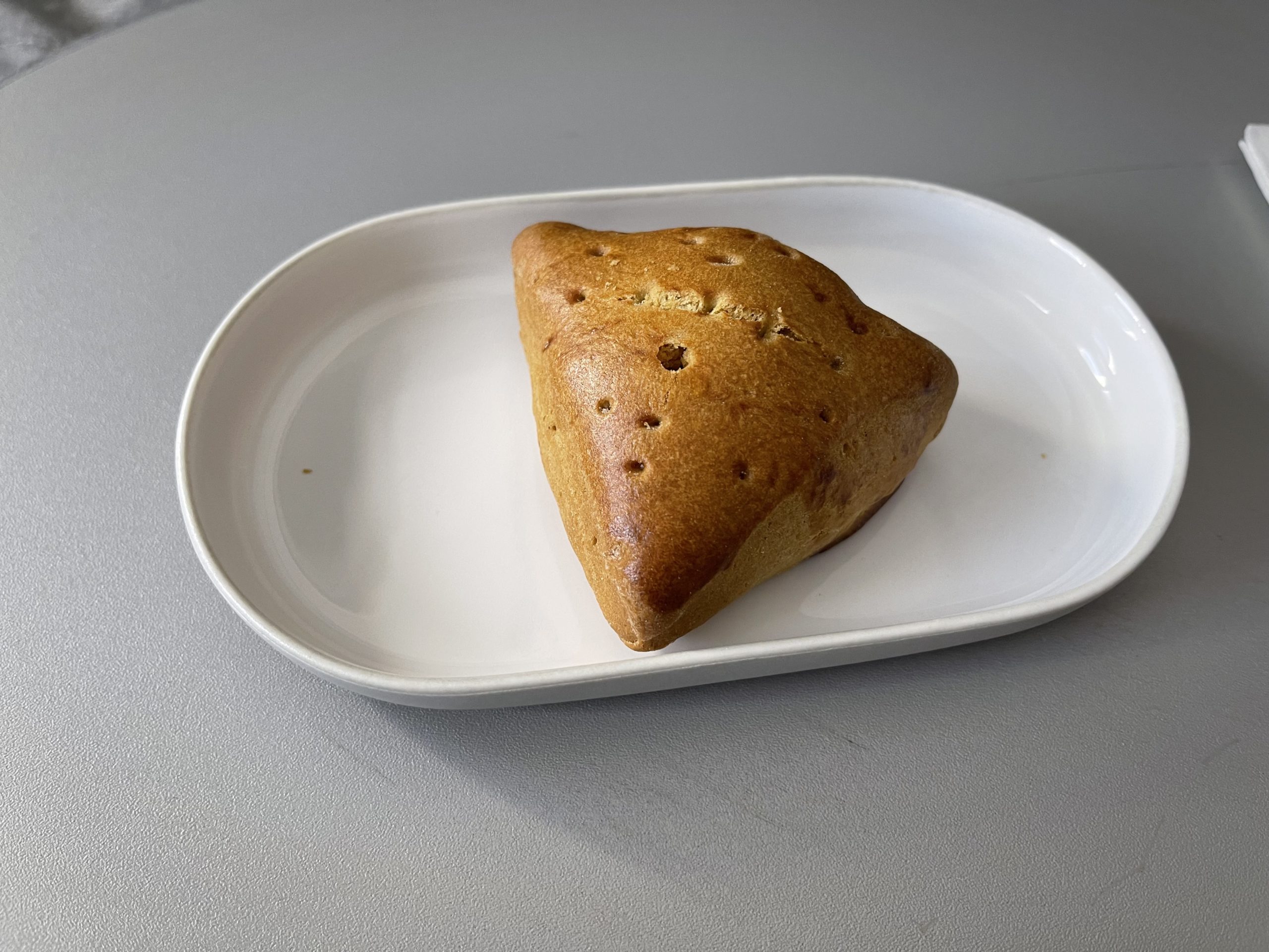 a triangular pastry on a plate