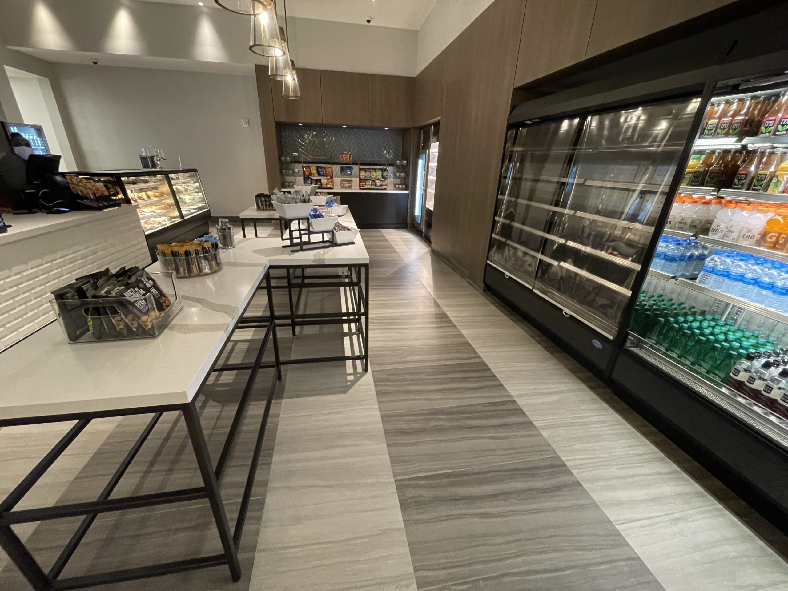 a room with a refrigerated display case