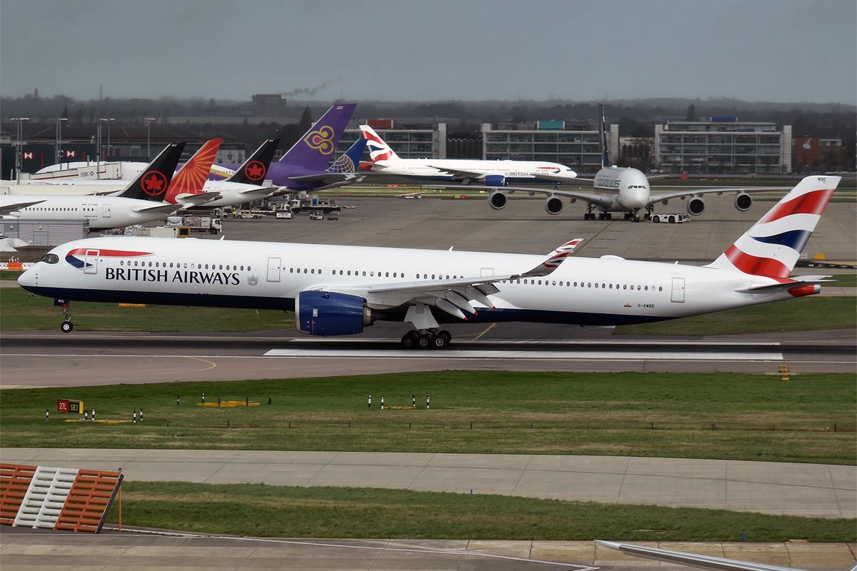 a group of airplanes on a runway