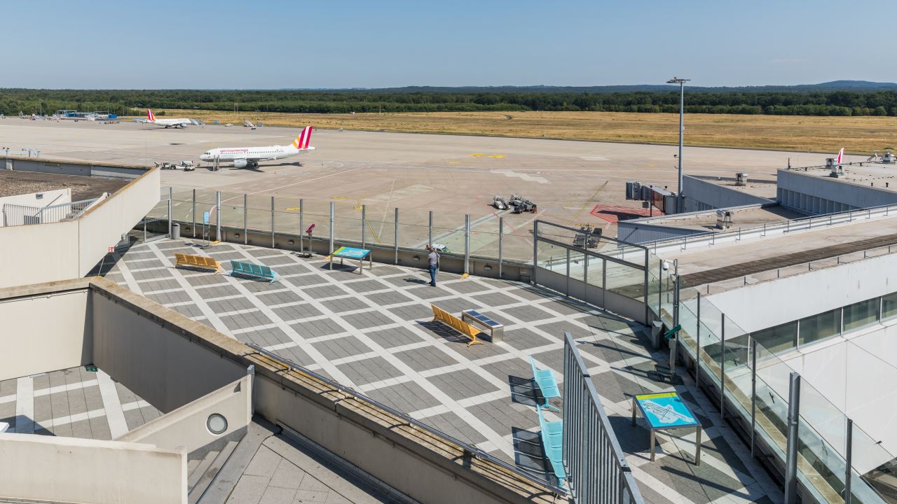 an airport with a plane on the runway