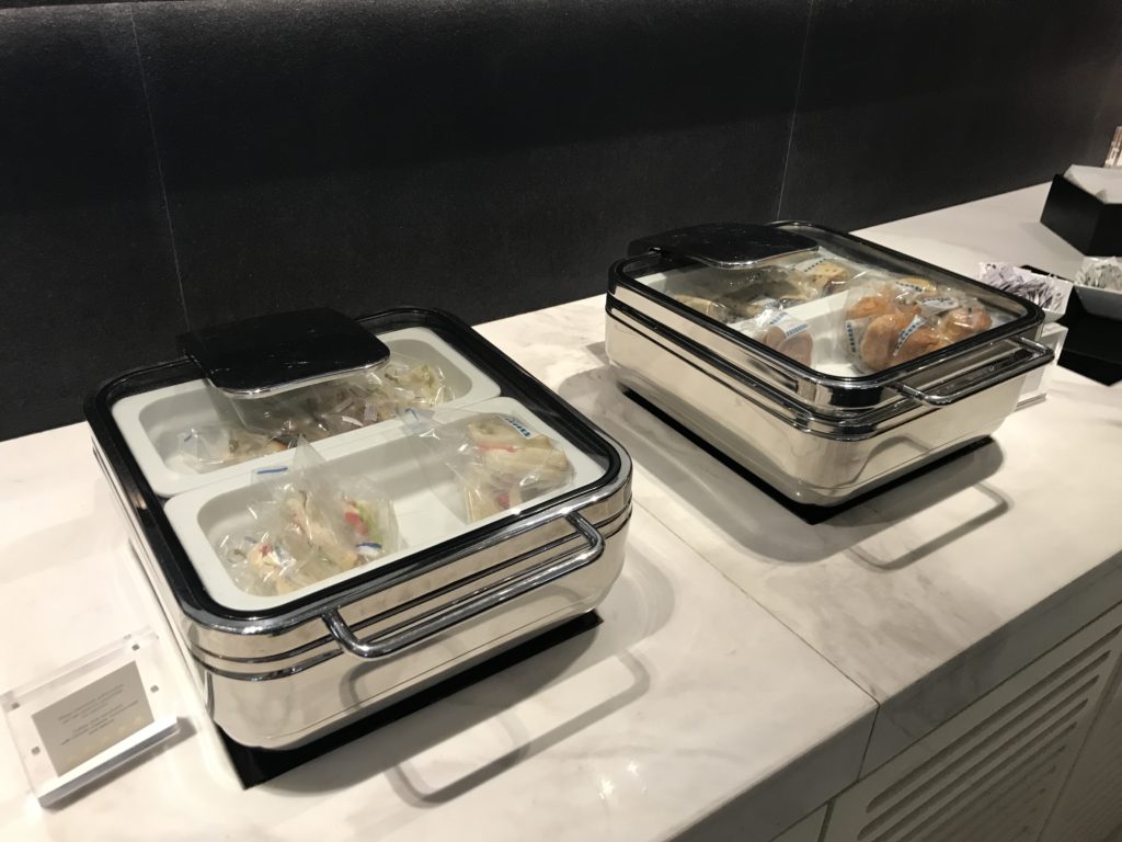 food in containers on a counter