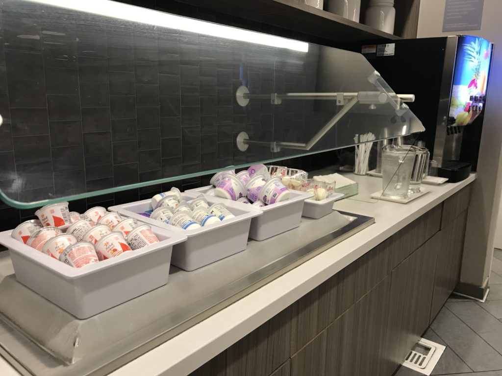 a counter with containers of yogurt