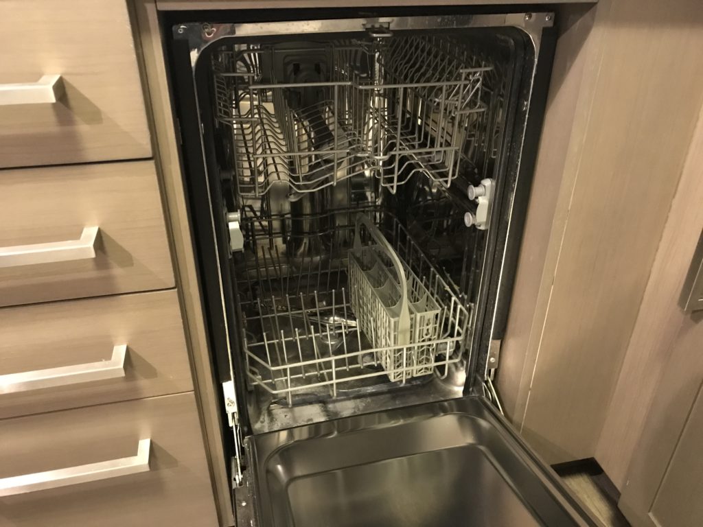 a dishwasher with a basket and a sink
