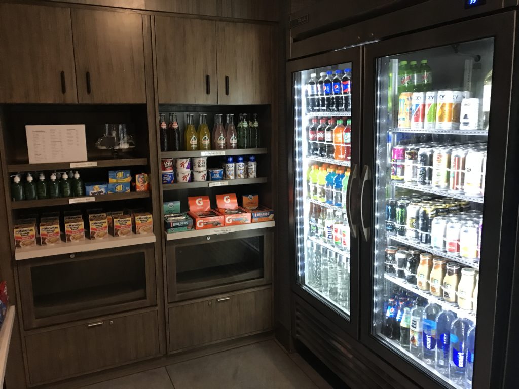 a refrigerator with drinks and beverages