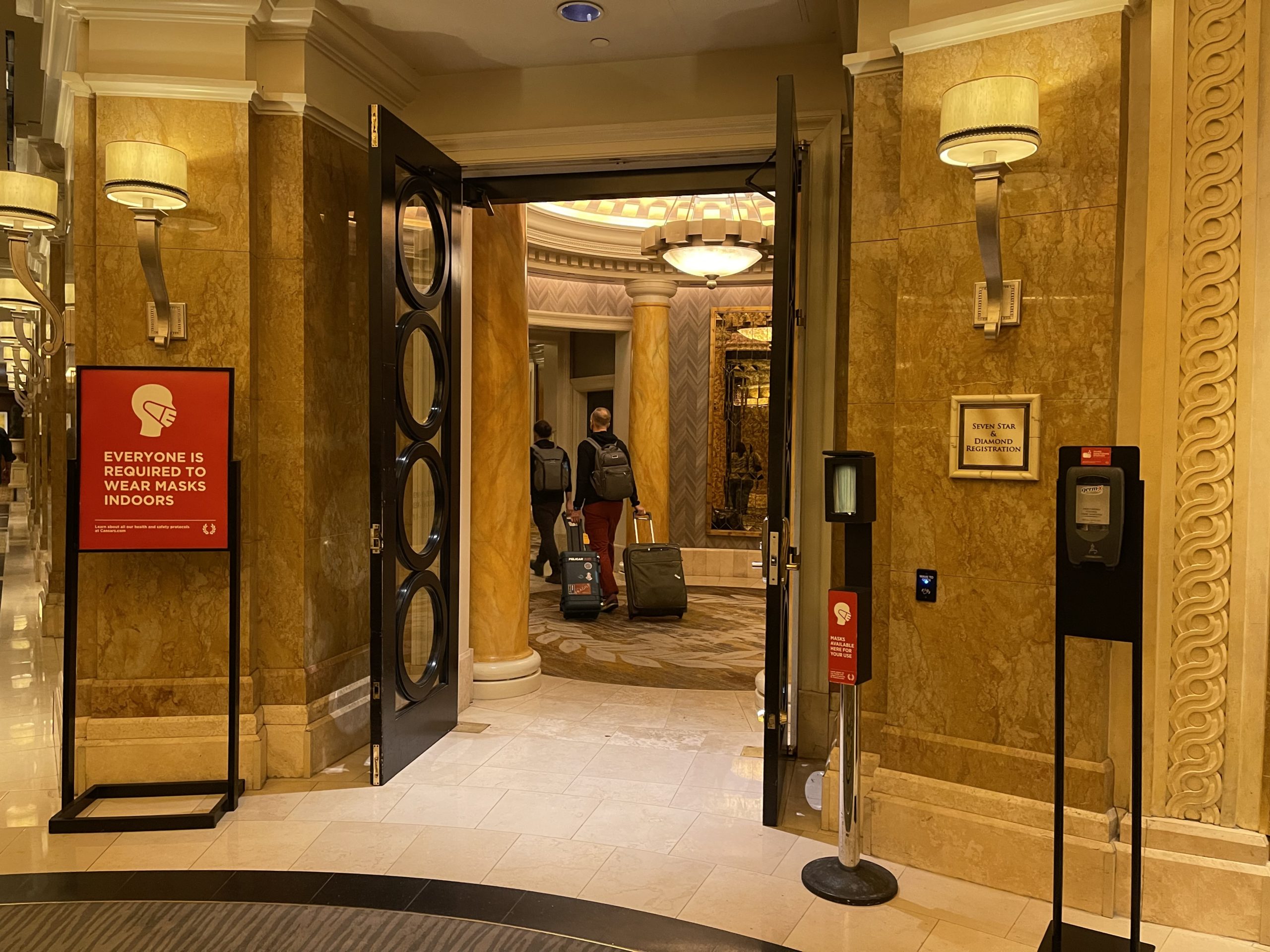 a man walking into a hotel lobby